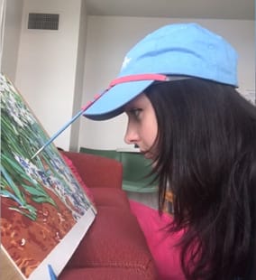 Amelia Coffey demonstrating her stylus holder.