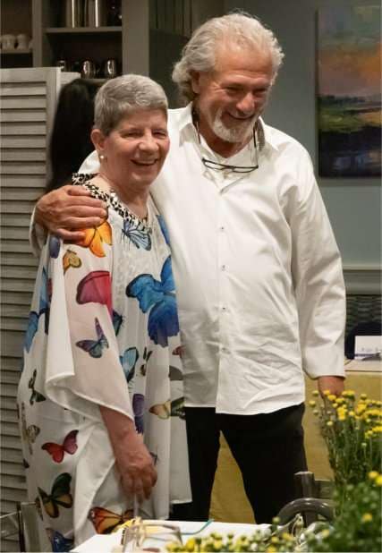 Julie Hahnke receives a hug from Eddie Gingle. (Eddie and Marcie came after they put their beloved dog down earlier that day.)