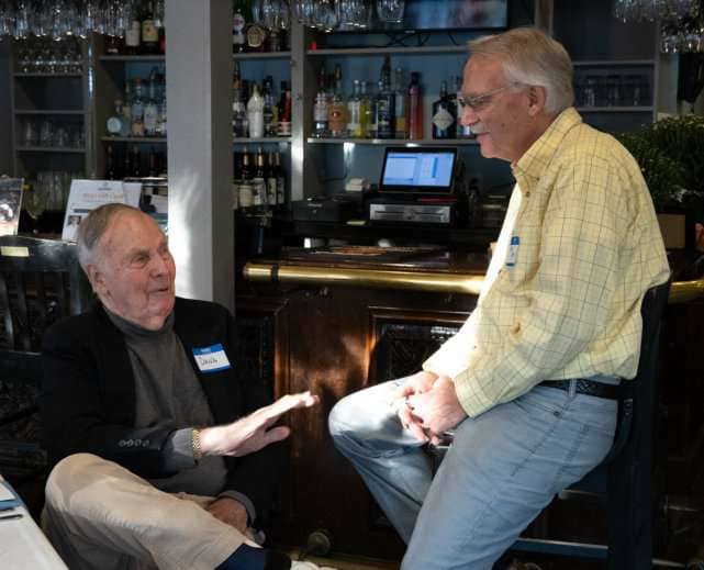 Dana Denault chatting with Bob Sooy.