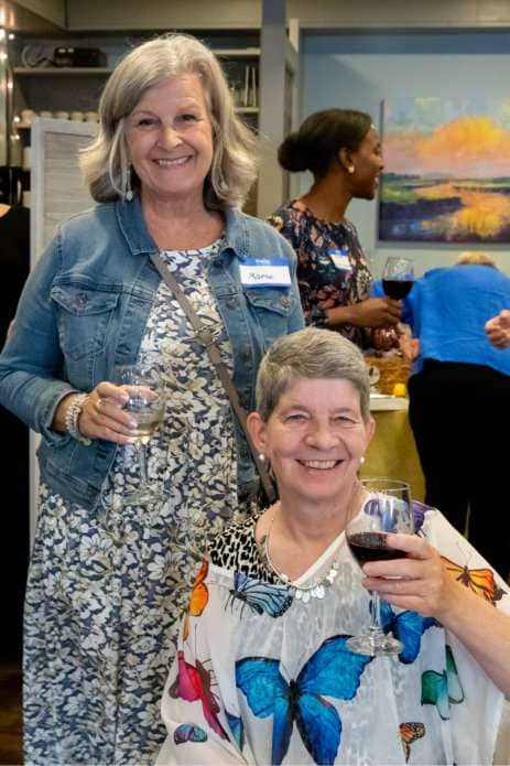 Marcie Gingle sharing a drink with Julie Hahnke.